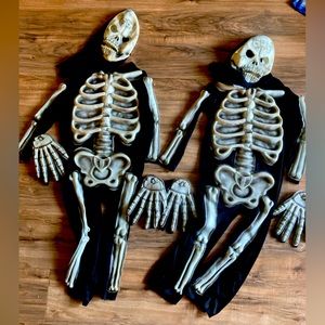 Two boys size small skeleton costumes glow in the dark